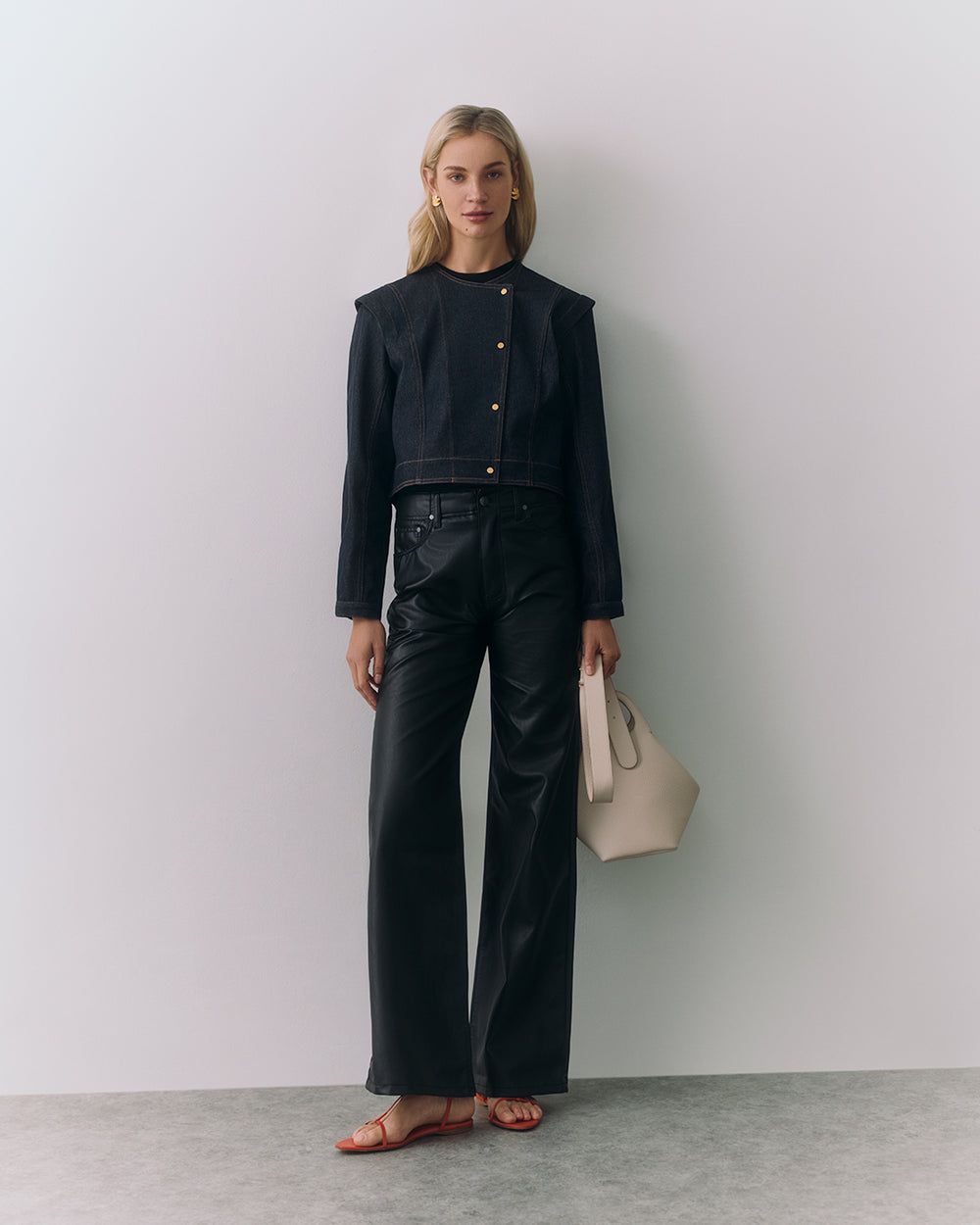 Light Sculpted Jacket Person wearing jacket and trousers holding a handbag