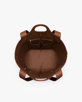 Open tote bag with multiple pockets inside.