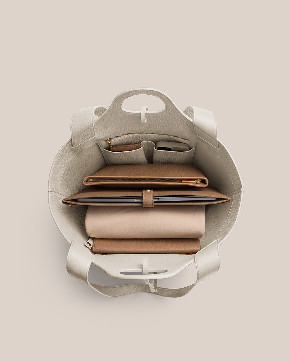 Paloma Tote Open handbag showing neatly organized contents inside.