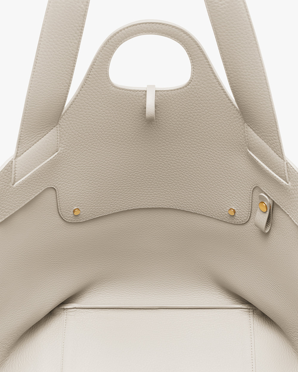 Paloma Tote Close-up of an open tote bag with two snaps and a handle.