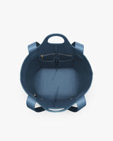 Large open tote bag with multiple interior pockets and short handles.