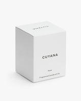 Box of Cuyana Rosa scented candle on a plain background.