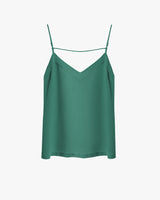 Sleeveless camisole with thin straps and a V-neckline on a plain background