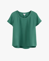 Short-sleeve blouse with a round neckline on a plain background