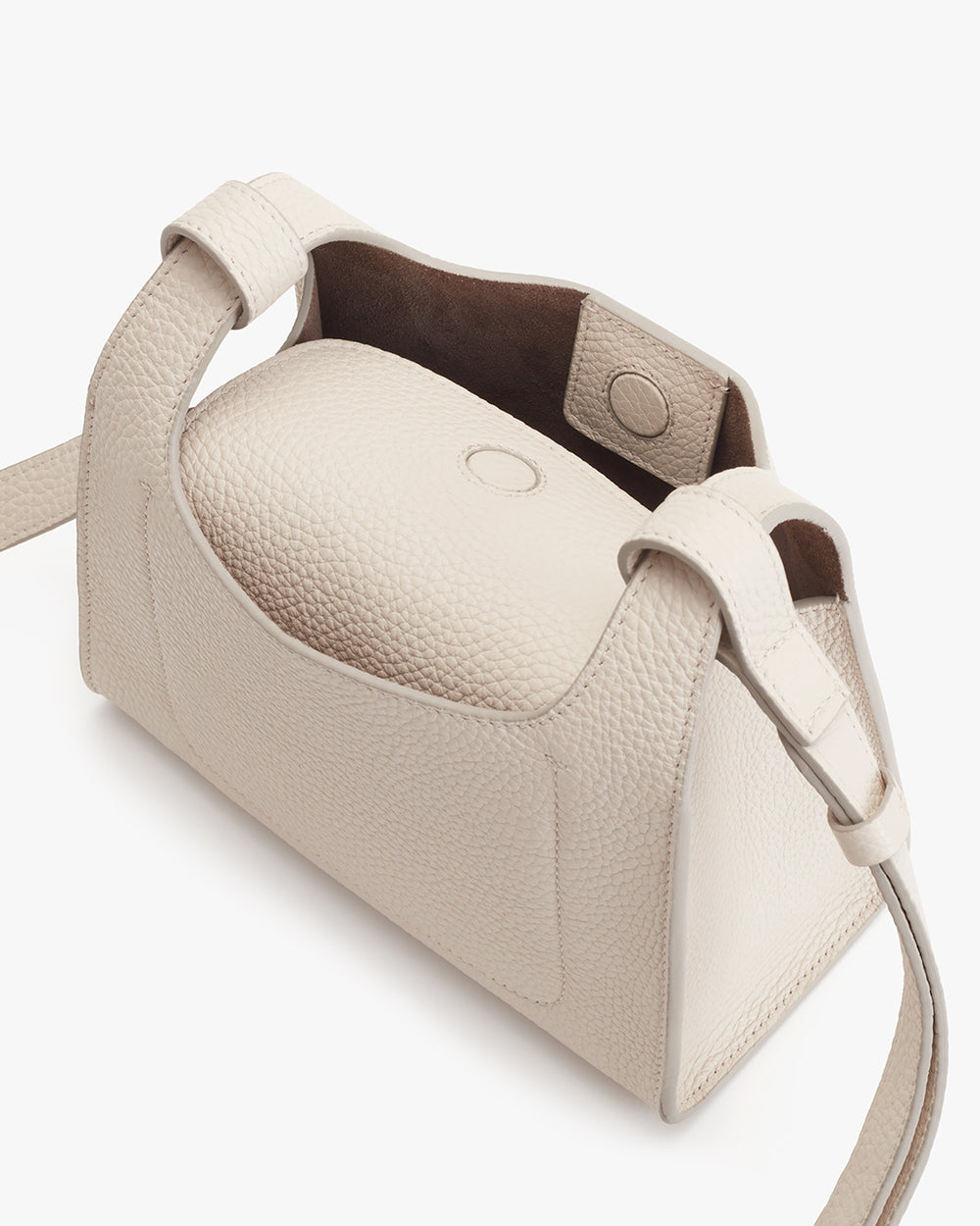 Open handbag with visible interior and a strap