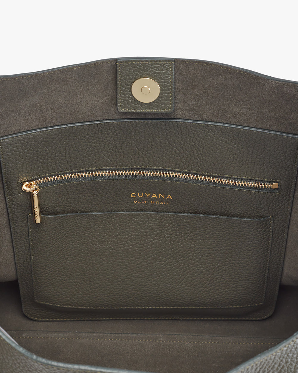 Oversized Double Loop Bag Close-up of a handbag with a zipper pocket and brand logo.