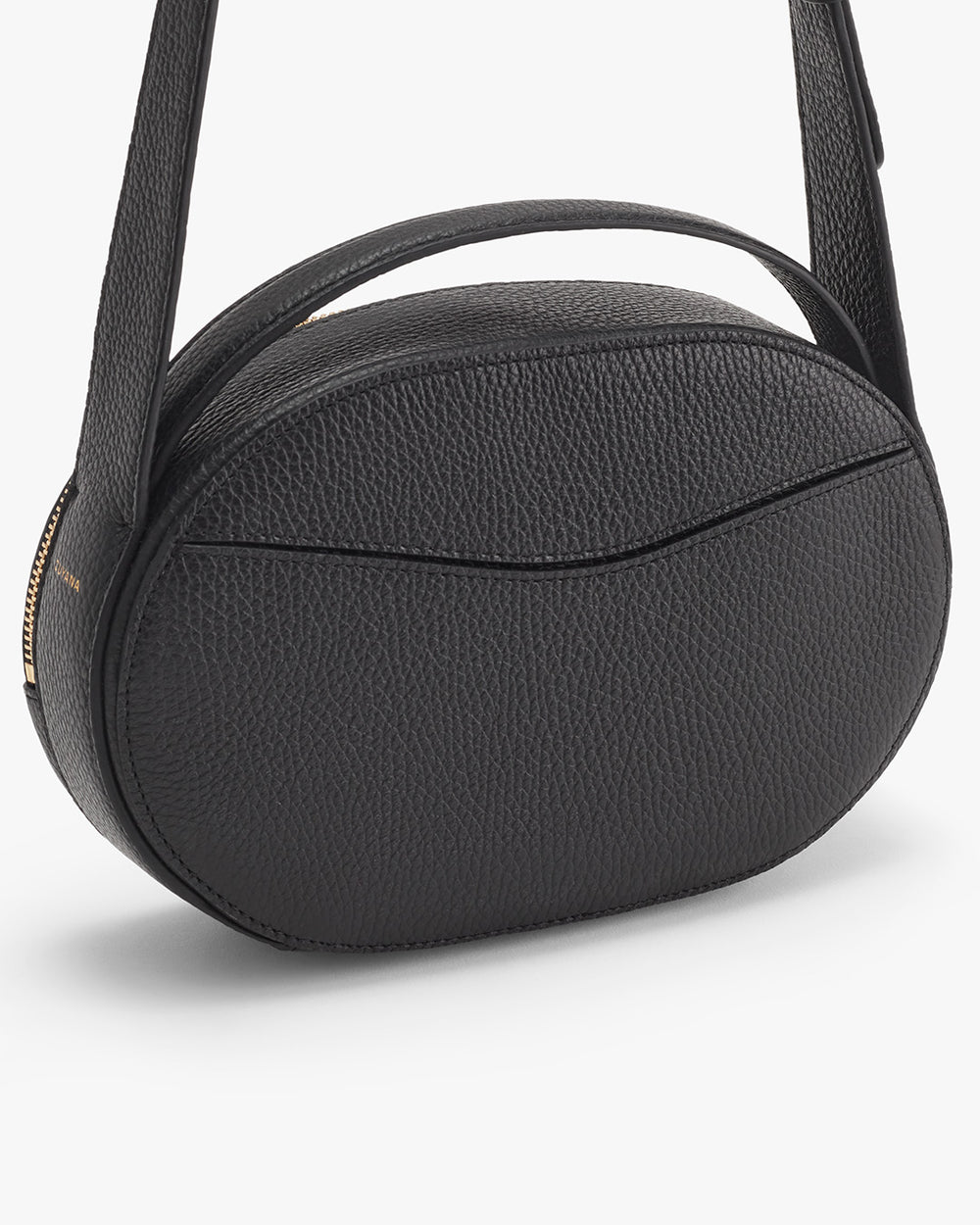 Small round handbag with shoulder strap and zipper closure.