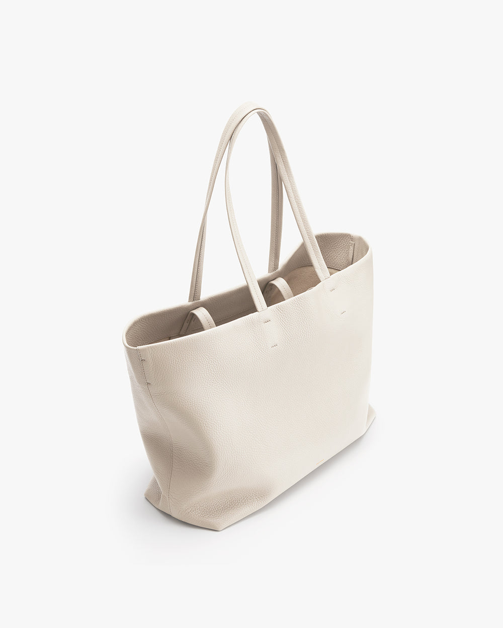 Upright tote bag with two handles on a plain background.