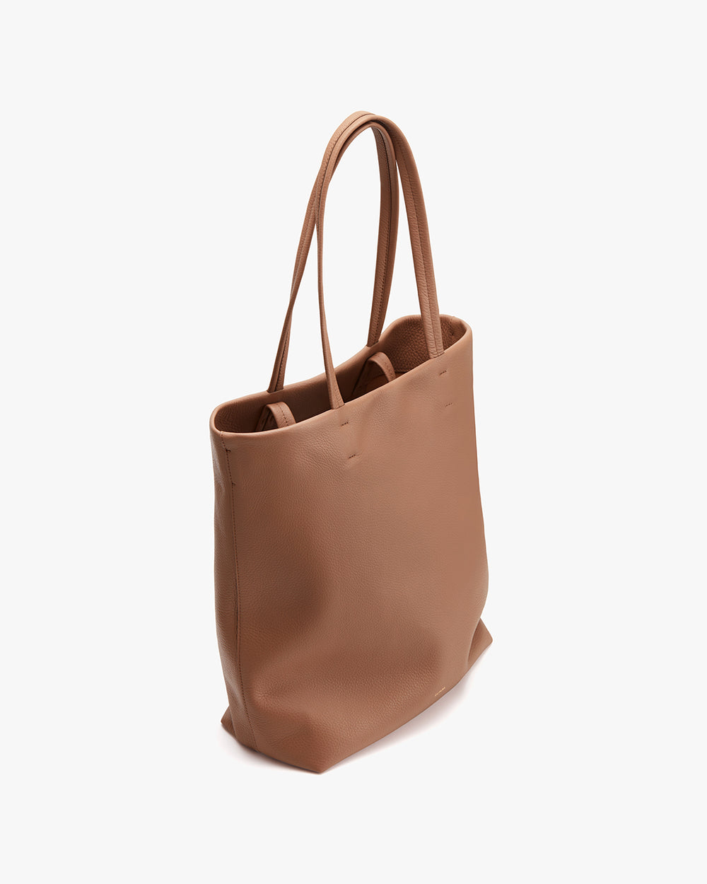 Leather tote bag standing upright on a plain background.