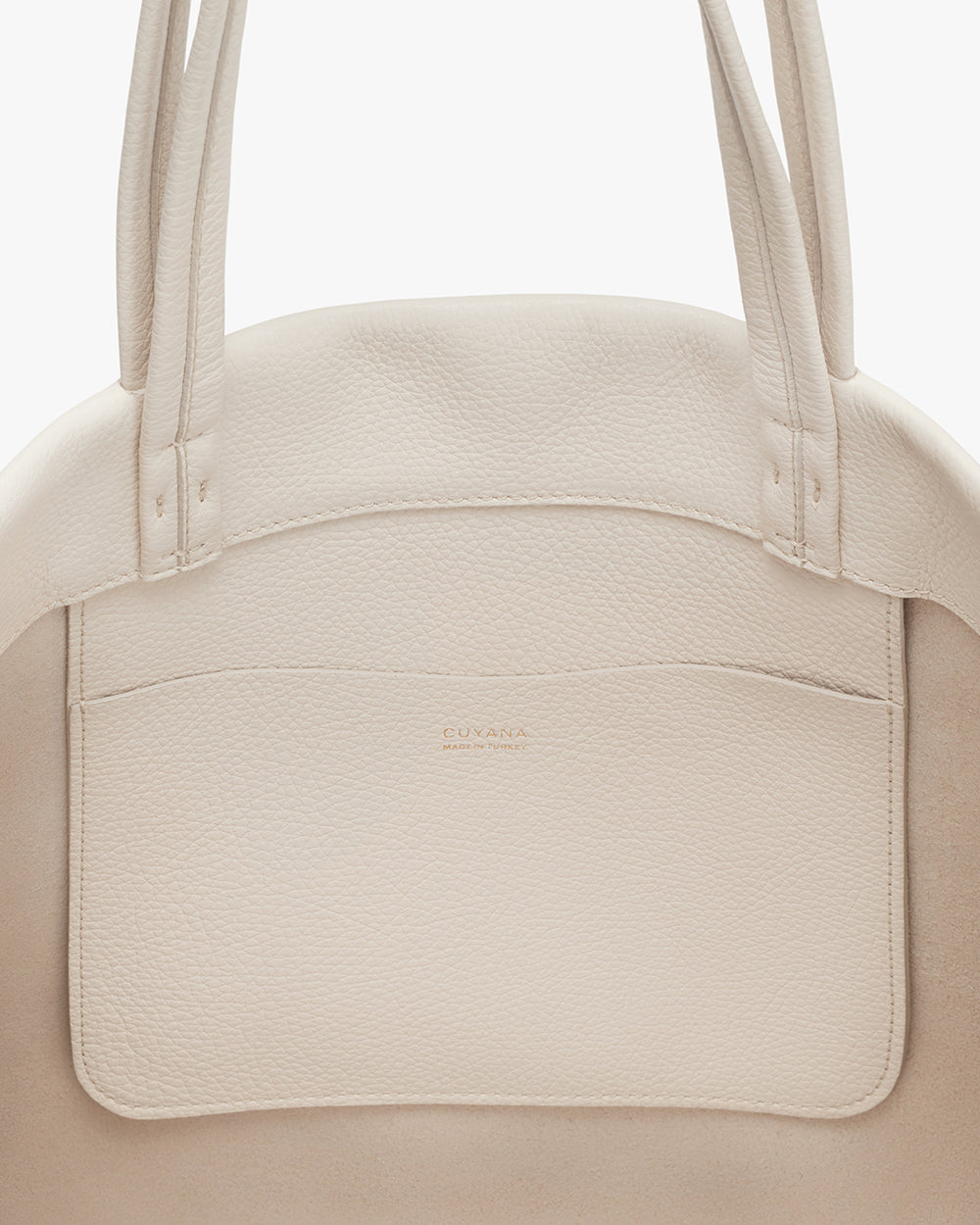 Classic Easy Tote Close-up view of a handbag with dual handles and a front pocket.