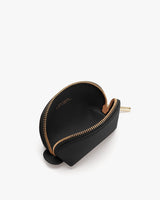Small zippered coin purse on a white background.