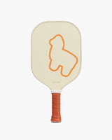 Pickleball paddle with a dog silhouette on the face and textured grip handle.