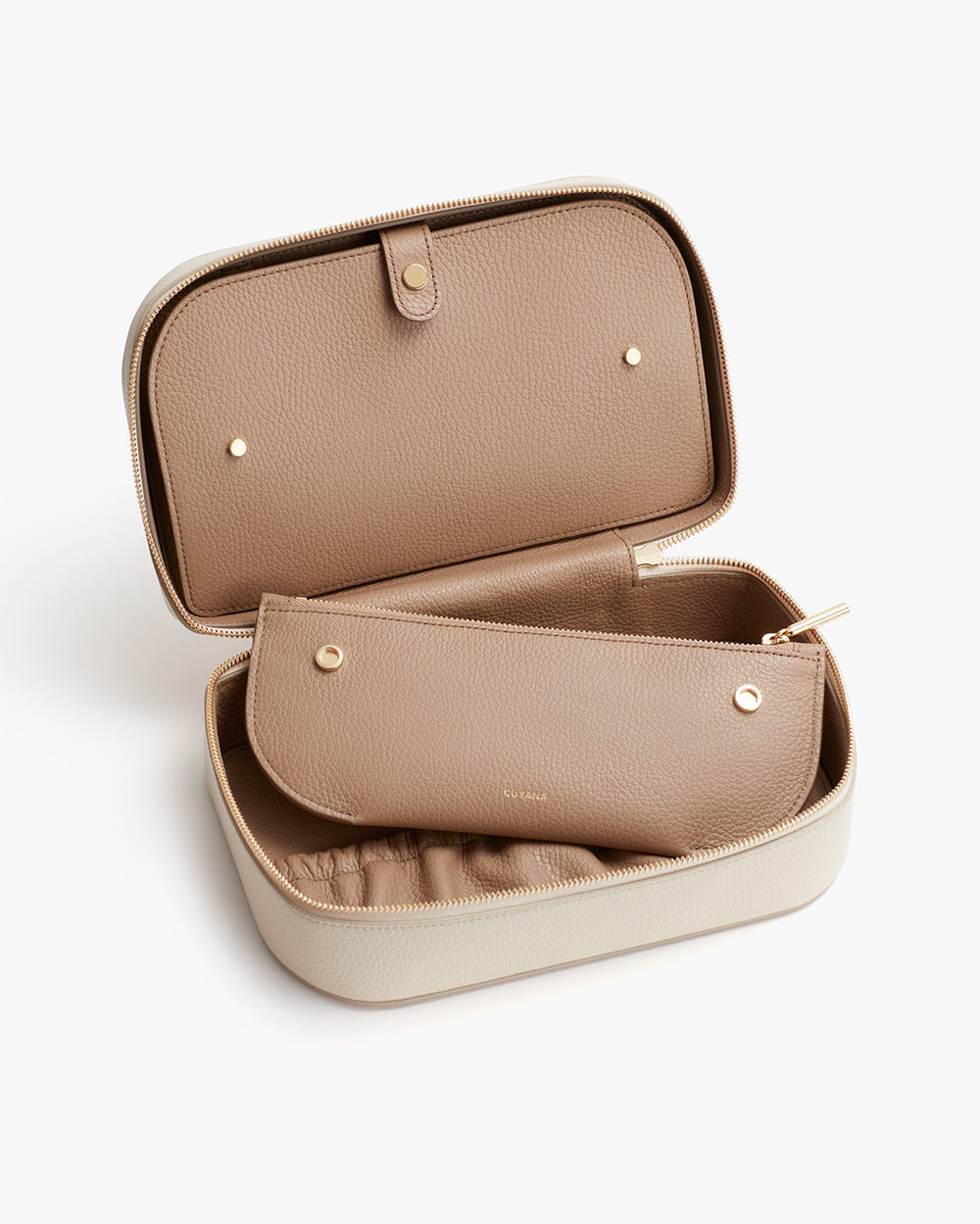 Open case with a smaller pouch inside placed on a plain background.