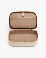 Open rectangular case with a compartment and a zippered section inside.