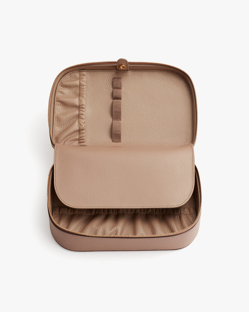 Open travel organizer with compartments and zipper closure.