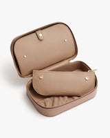 Open travel case with a smaller pouch inside.
