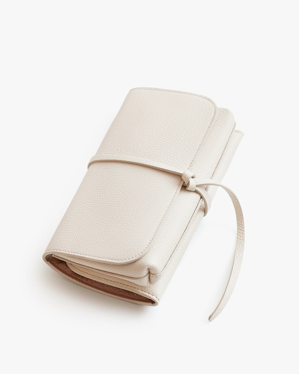 Closed planner with a wrap-around tie on a plain background.