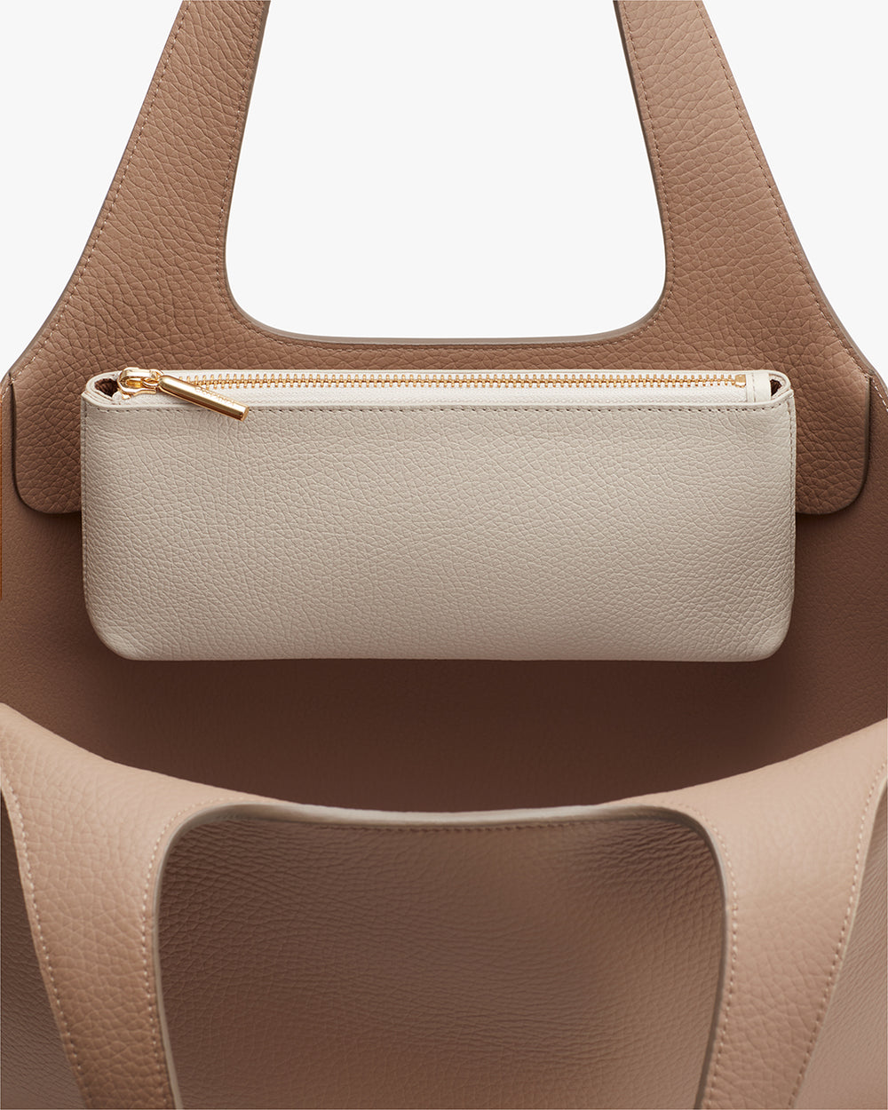 Handbag with a zipper pouch hanging on the front.