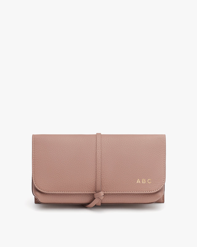 Wallet with a bow and personalized initials 'ABC' on front.