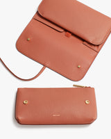 Purse and wallet on a plain background.