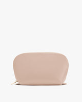 Small zippered pouch standing on a flat surface