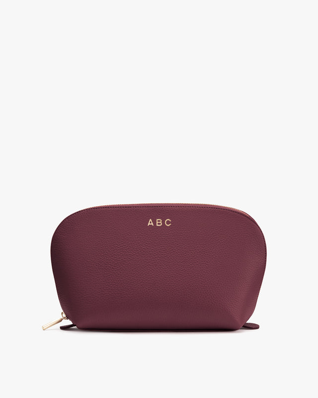 Small zippered pouch with personalized initials 'ABC' on the front.