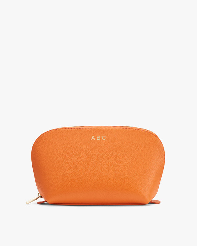 Personalized cosmetic bag with initials A.B.C. on it.