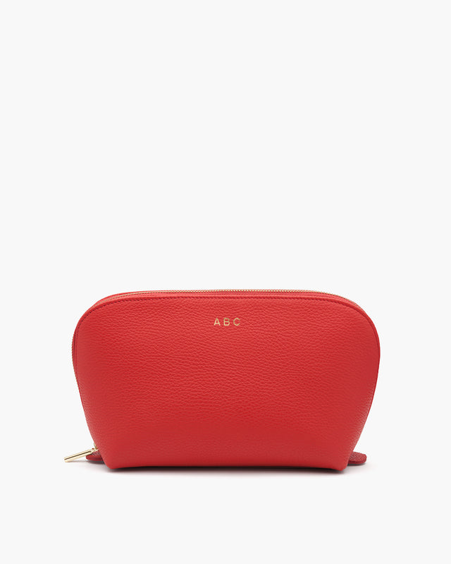 Textured cosmetics bag with initials 'ABC' on front.