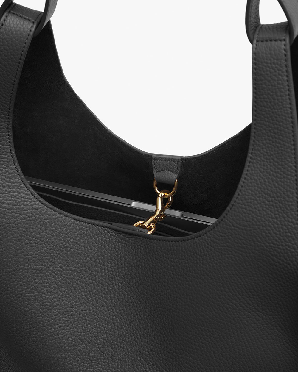 Close-up view of a handbag with a metal clasp detail.