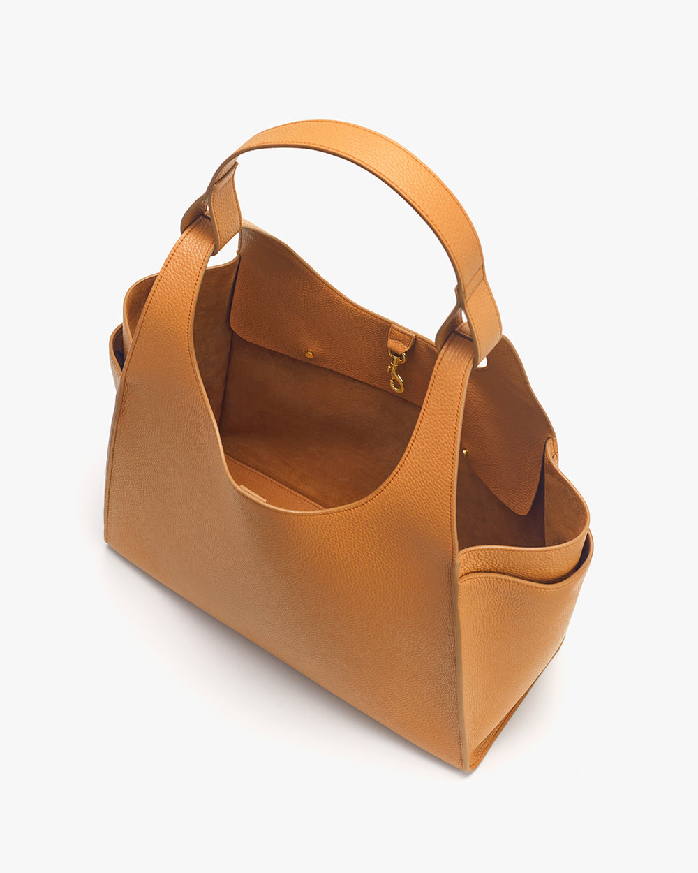Top view of an open handbag with dual handles and metal clasp.
