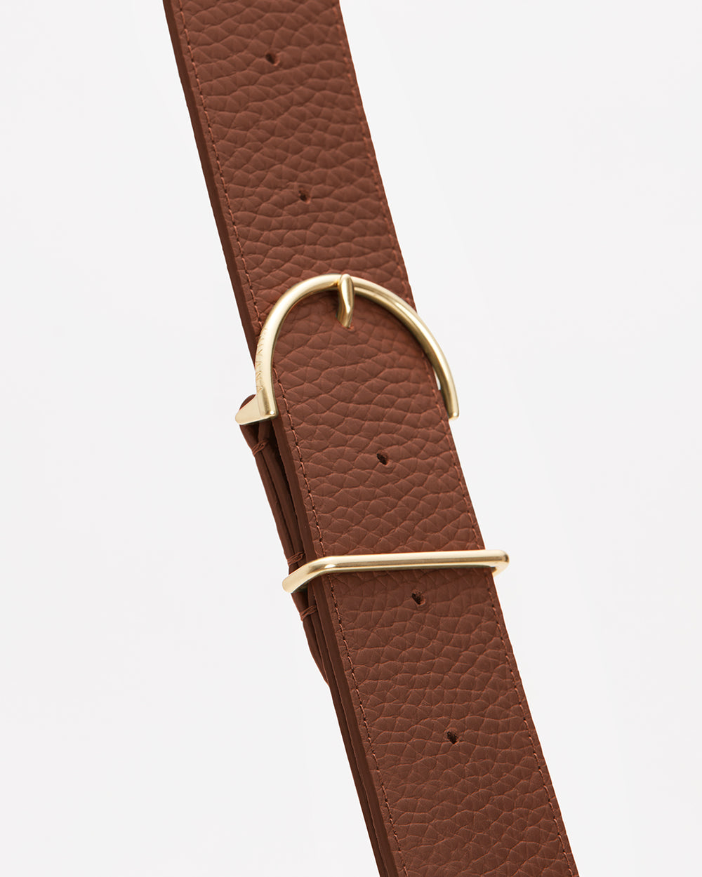 Adjustable Wide Strap Leather Strap with a metal buckle and keeper.