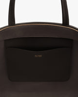 Close-up of a bag with a visible interior pocket and zipper.
