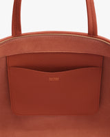 Close-up of a bag with a pocket and visible zipper.