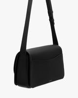 Shoulder bag with adjustable strap and back pocket.