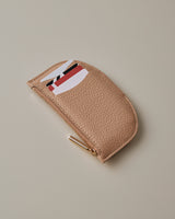 Small zippered card holder with slots for cards.