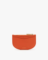 Small zippered wallet with semicircular design.
