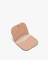 Open wallet with a textured interior and a button clasp.