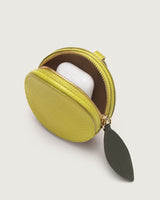 Round coin pouch with open zipper and a small item inside.