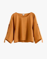 Loose-fitting, three quarter sleeve blouse with wide neckline.
