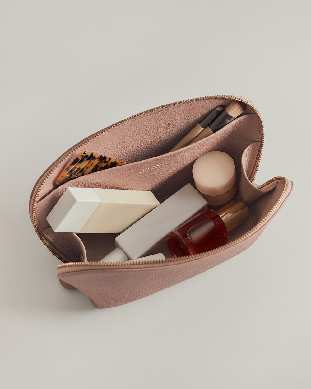 Medium Travel Case Open pouch with cosmetics and brushes inside