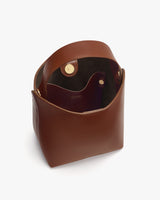 Open handbag with visible interior pockets and magnetic closure flap