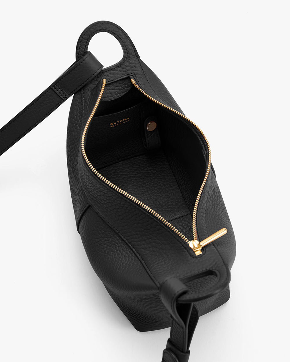 Open handbag with gold zipper and shoulder strap.