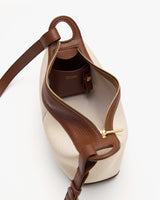 Open bag with visible zip and inner pocket.