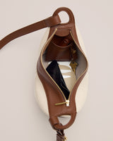 Open shoulder bag with visible items like wallet and keys inside.