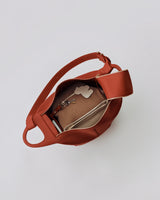 Open bag with items including keys and a pouch inside