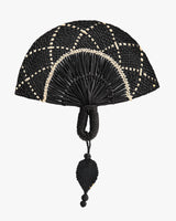Woven hand fan with intricate pattern and handle loop.