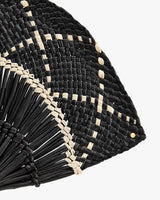 Close-up of woven fan.