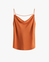 Sleeveless top with thin straps and draped neckline.