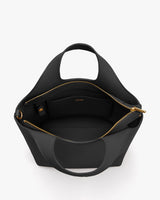 Open handbag with interior pocket and zip closure