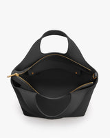 Open handbag with visible inner pocket and two small handles